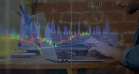 Man Engaged in Financial Analysis with Charts over Modern Workspace