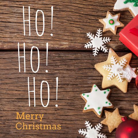 Festive christmas cookie and ornament layout on wooden surface