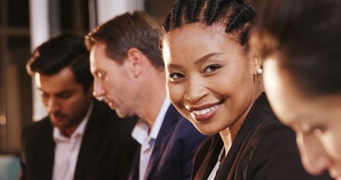 Confident Businesswoman Smiling in Diverse Team Meeting - Download Free Stock Images Pikwizard.com