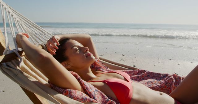 Relaxed Woman Sunbathing on Beach Hammock by Sea - Download Free Stock Images Pikwizard.com