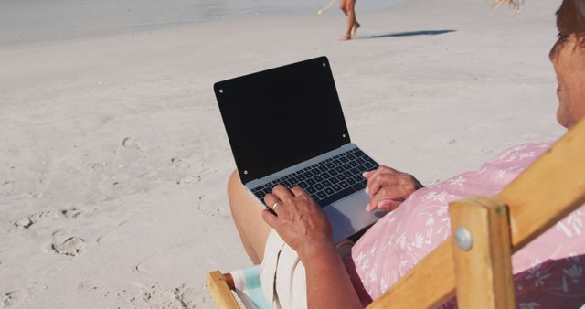 Senior Woman Relaxing on Beach with Laptop - Download Free Stock Images Pikwizard.com