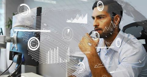 Data analyst analyzing real-time dashboard with futuristic hud overlays at workstation for insights