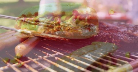 Outdoor backyard bbq with hot dogs, jalapeños and grilled meats