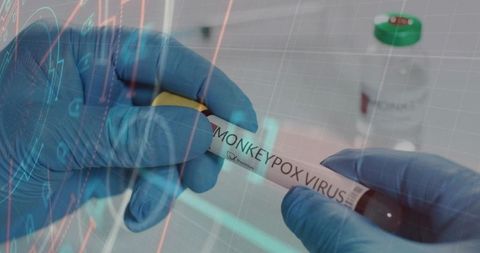 Holding monkeypox virus test tube with nitrile gloves, yellow cap, digital readout