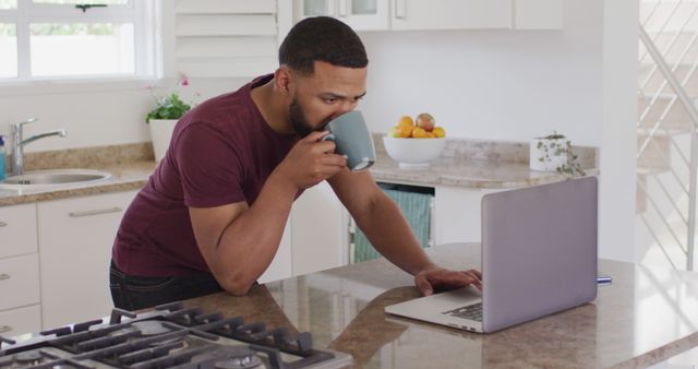 Man Working from Home in Modern Kitchen While Drinking Coffee - Download Free Stock Images Pikwizard.com