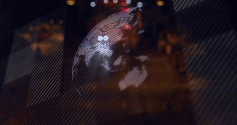 Translucent globe projection over urban night street showing asia australia map and bokeh