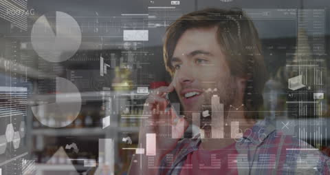 Businessman Analyzing Data over Smartphone Call in Modern Workspace