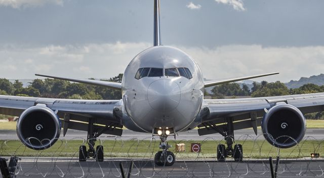 Front View of Commercial Airplane on Runway Before Takeoff - Download Free Stock Photos Pikwizard.com