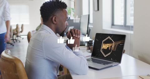 Man Exploring NFT on Laptop with Interactive Social Icons - Download Free Stock Images Pikwizard.com