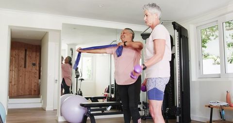 Senior Couple Exercising at Home Gym, Embracing Healthy Retirement Lifestyle