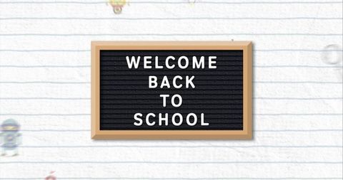 Welcome Back to School Blackboard with Lined Paper Background