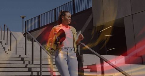 Woman descending concrete staircase at modern architecture