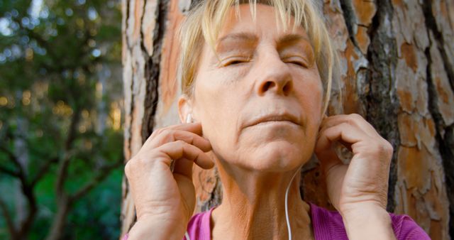 Serene Senior Woman Enjoying Nature with Headphones - Download Free Stock Images Pikwizard.com