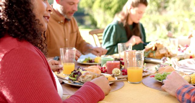 Family Enjoying Outdoor Meal with Thanksgiving Decorations - Download Free Stock Images Pikwizard.com