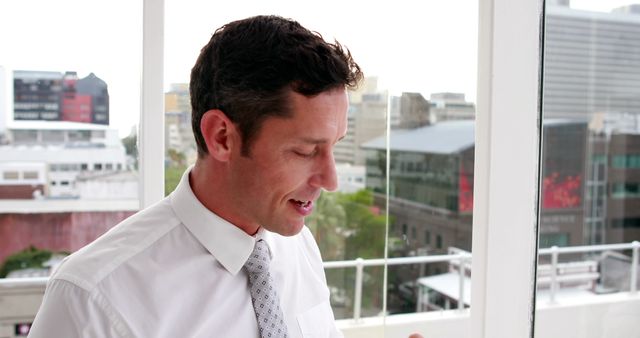 Businessman in White Shirt Discussing at Modern Office with Cityview - Download Free Stock Images Pikwizard.com