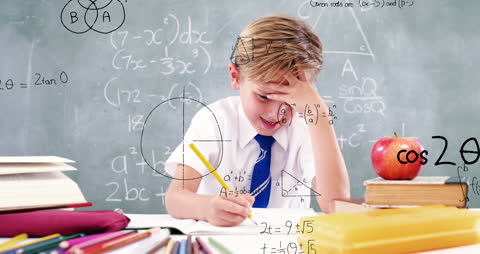 Focused Boy Solving Math Problems at Home