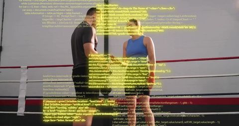 Boxing couple facing each other in ring with projected code overlay blending fitness and tech