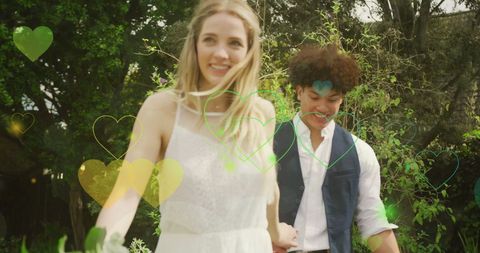 Joyful Wedding Couple Walking Through Lush Garden on Summer Day