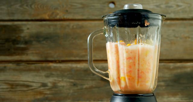 Blender Making Colorful Smoothie Against Rustic Wood Background - Download Free Stock Images Pikwizard.com