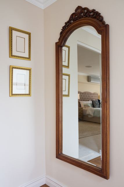  Wooden framed mirror on wall at home