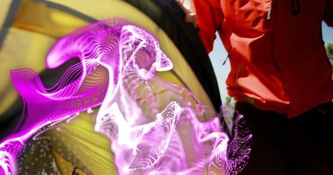 Man adjusting yellow tent at campsite with purple energy trail, outdoor adventure concept