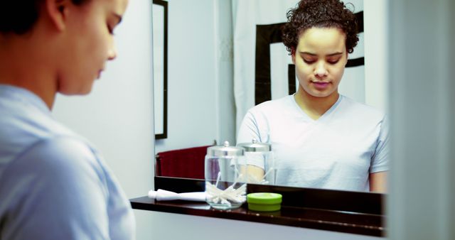 Young Woman Reflecting in Bathroom Mirror - Download Free Stock Images Pikwizard.com