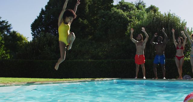 Diverse group of friends having fun jumping into a swimming pool - Download Free Stock Photos Pikwizard.com