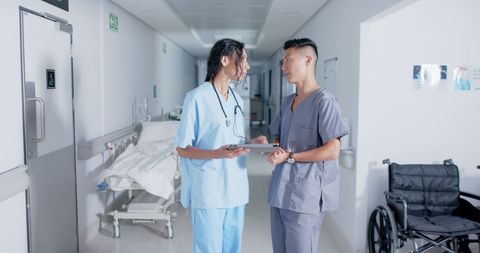 Focused Doctors Collaborating in Hospital Corridor - Download Free Stock Images Pikwizard.com