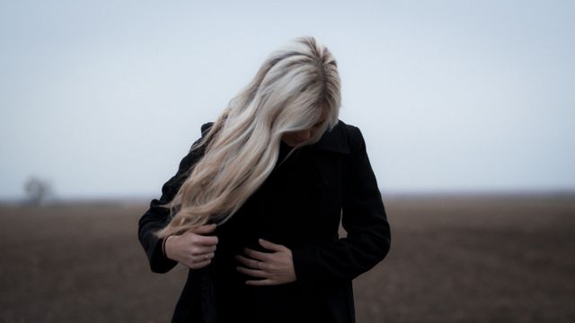 Solitary Woman in Black in Desolate Field - Download Free Stock Photos Pikwizard.com