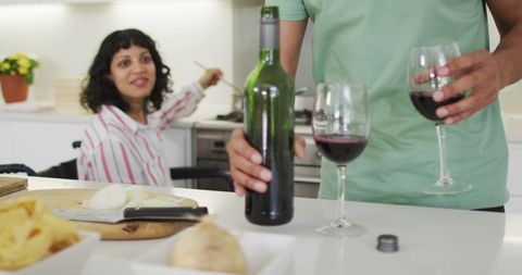 Couple Enjoying Wine and Cooking in Modern Kitchen Together - Download Free Stock Images Pikwizard.com