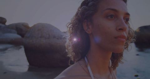 Contemplative Woman at Sunset Beach Cove Embracing Serenity