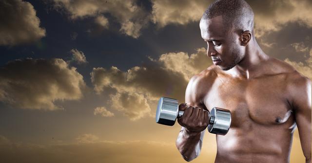 Male athlete shown lifting a dumbbell against a backdrop of an evening sky with dramatic clouds. Perfect for fitness marketing, motivational content, health and wellness materials, and bodybuilding promotions.