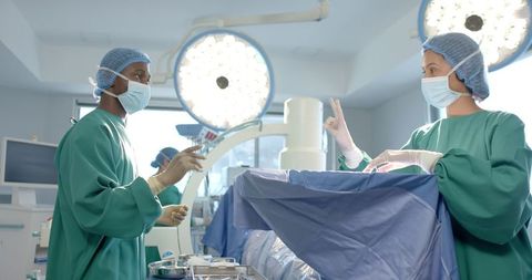 Surgeons Collaborating in Operating Room: Teamwork in Surgery - Download Free Stock Images Pikwizard.com