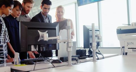 Diverse team collaborating on digital global interface project