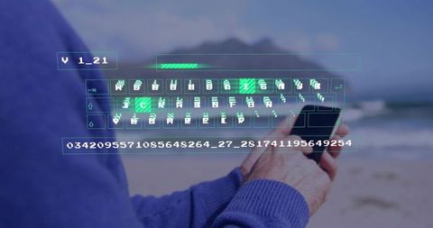 Mature man holding smartphone at seaside typing with holographic keyboard overlay