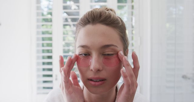 Woman Relaxing with Under-Eye Gel Patches for Skincare Treatment - Download Free Stock Images Pikwizard.com