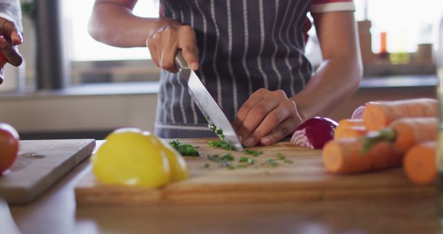 Close-Up of Hands Slicing Herbs on Cutting Board in Kitchen - Download Free Stock Images Pikwizard.com