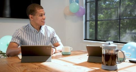 Diverse Professionals Celebrating Work Achievements in Bright Office