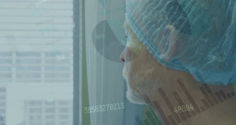 Senior Surgeon Analyzing Healthcare Data at Hospital