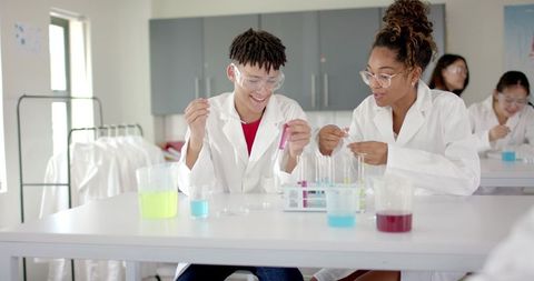 High School Students Engaged in Science Experiment in Laboratory