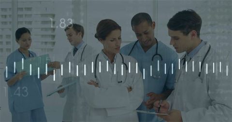 Medical Team Collaborating in Hospital with Stethoscopes and Charts