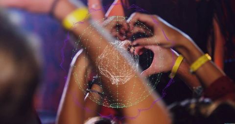 Diverse concert crowd forming heart hands with yellow wristbands and holographic overlay