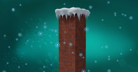 Snow-covered brick chimney against green winter background