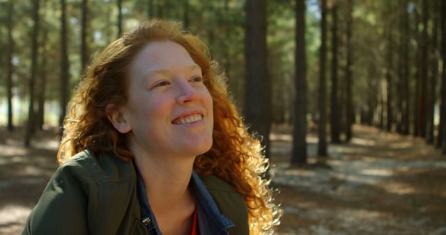 Happy Woman with Red Hair Enjoying Nature in Forest - Download Free Stock Images Pikwizard.com