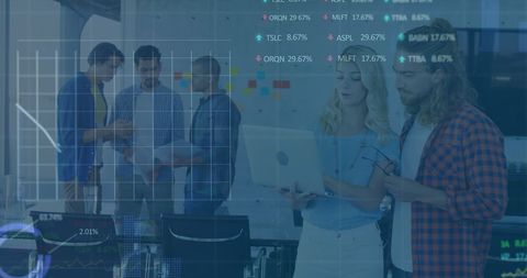 Diverse team analyzing digital data and market trends in modern office