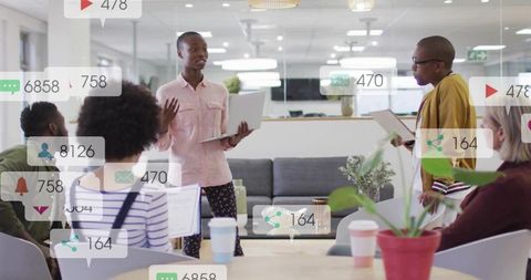 Leading woman presenting in modern open-plan office with digital analytics overlays