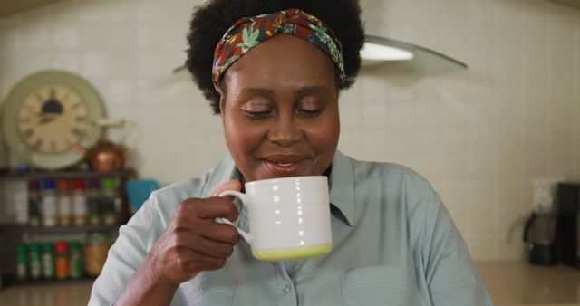 Senior Woman Enjoying Smelling Coffee in Cozy Kitchen - Download Free Stock Images Pikwizard.com