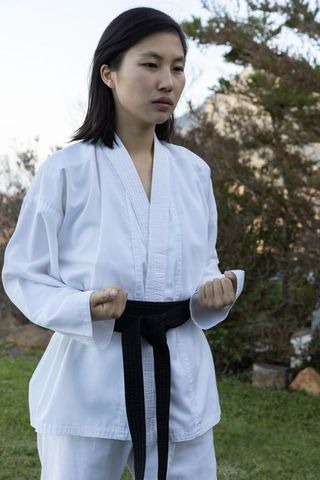 Confident Martial Artist in Suburban Garden Practicing Karate
