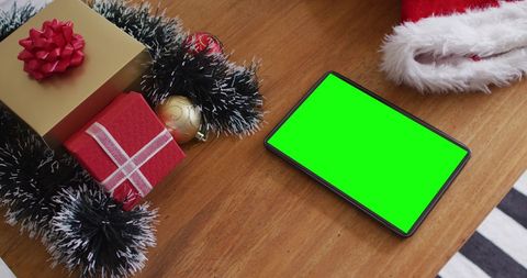 Tablet with Green Screen Surrounded by Christmas Decorations - Download Free Stock Images Pikwizard.com