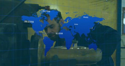 Inspecting technician leaning over workbench with global data overlay and metal machinery